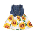 doll's dress with denim top and sunflower skirt on a white background