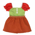 Doll dress with red sleeves and green top on a white background